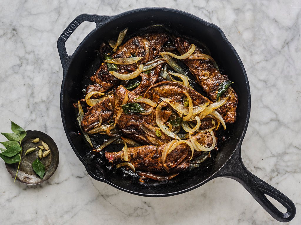 beef liver pan fried with garlic onions curry leaves green chillies (cooked dish)