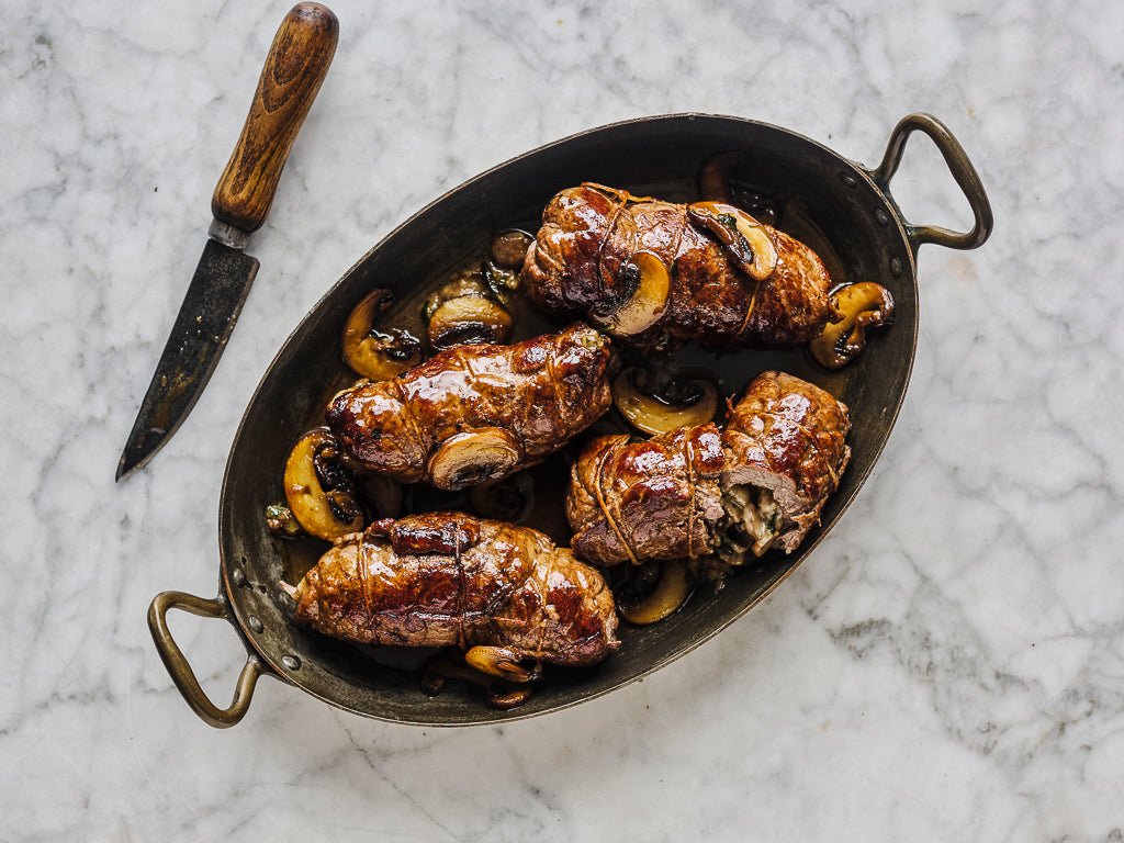 top steak escalopes involtini stuffed with mushrooms (cooked dish)