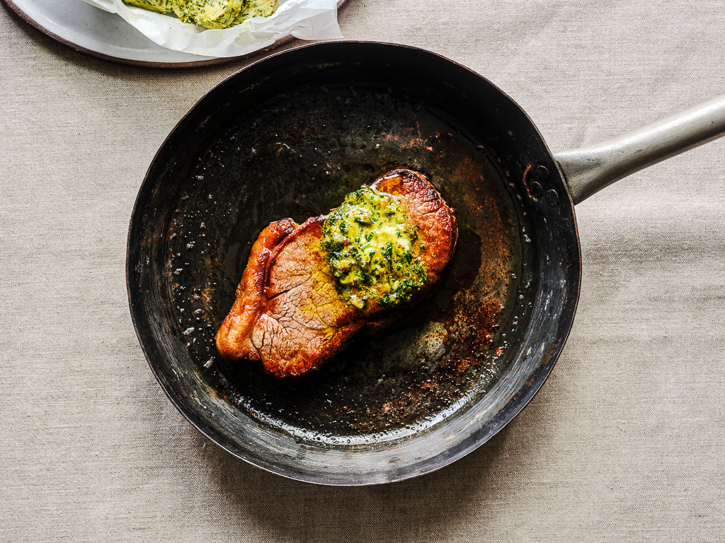 sirloin steak served with ginger garlic chili and coriander butter (cooked dish)